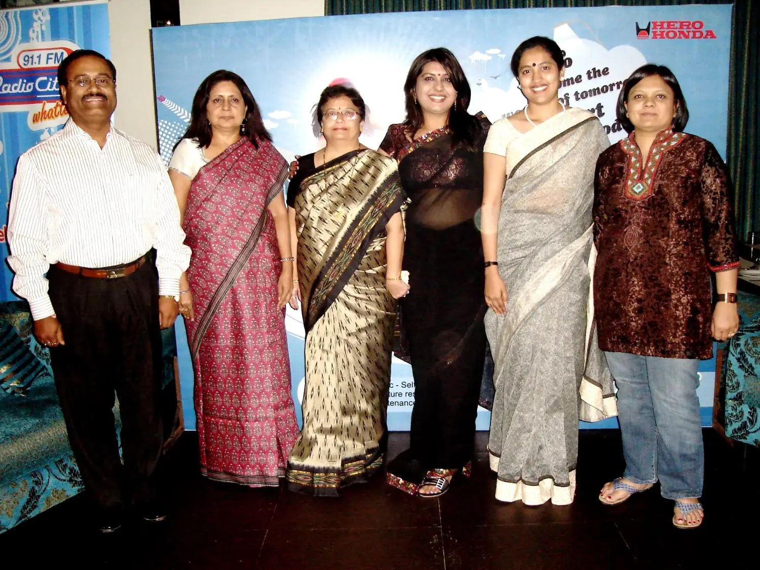 Man in suit speaking at podium with ITT logo on podium